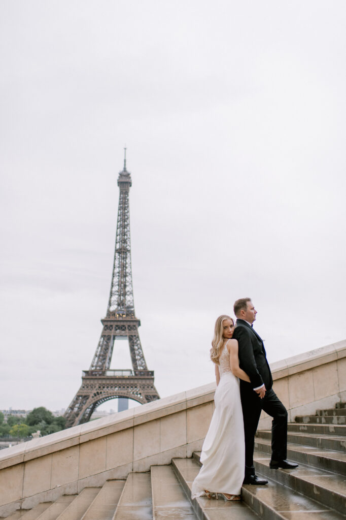 Bride and groom walking through Paris on their wedding day